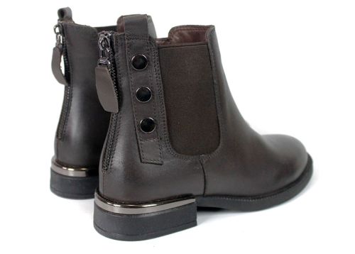 Brown genuine leather Chelsea boots with low heel for women.