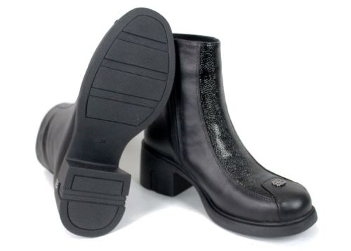 Black genuine leather ankle boots with embossed patent leather details.
